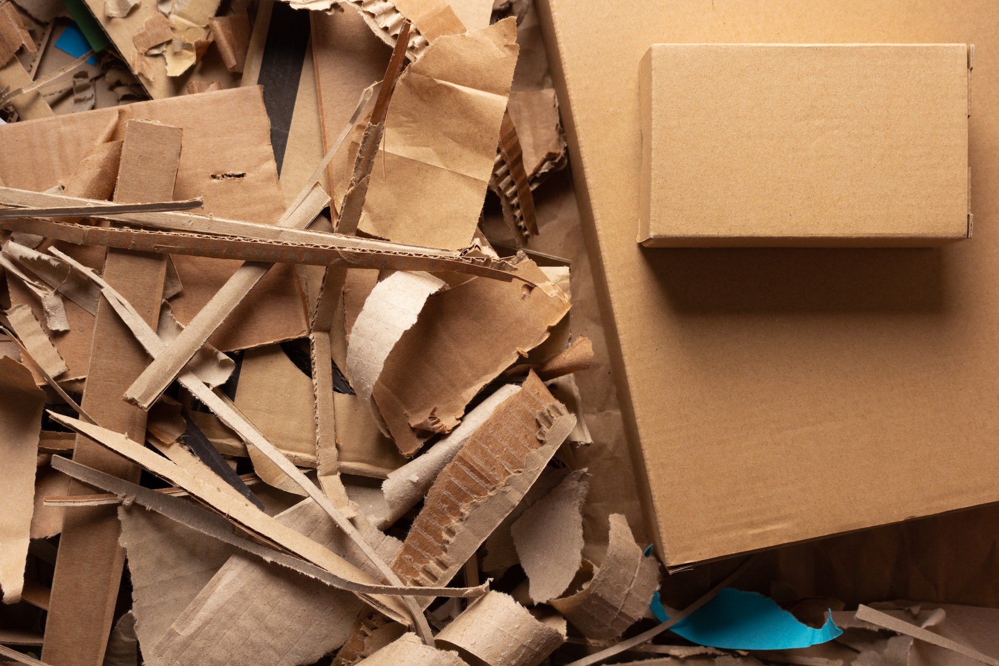 Waste paper and cardboard box background. Recycling concept and brown cardboard heap